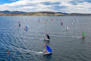 29er fleet tearing across the Derwent River in Hobart during the National Championships. Photo by Hartas Productions